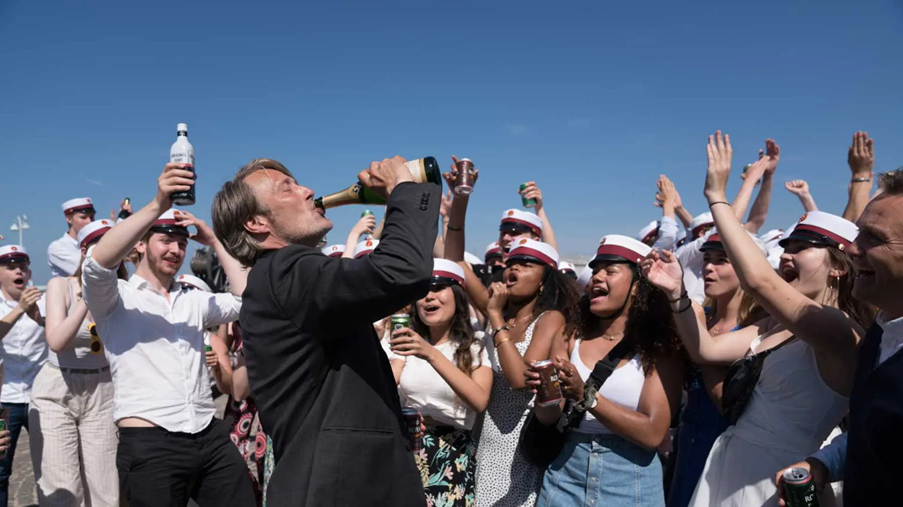 Post cover: Mads Mikkelsen as Martin in Druk (2020) celebrating with students.